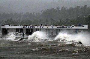 High waves brought about by strong winds pound a fish port, hours before typhoon Ruby passes near the city of Legazpi on Sunday. Ruby tore apart homes and sent waves crashing through coastal communities across central Philippines, adding to the spate of deadly disasters. (MNS photo)